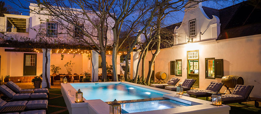 Relax by the pool under the evening skies at Akademie Street Boutique Hotel