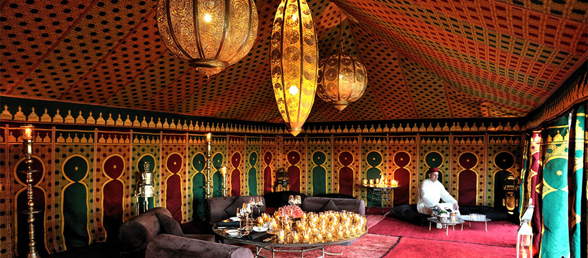Sit for a cup of tea under the decor of a Moroccan tent at Amanjena