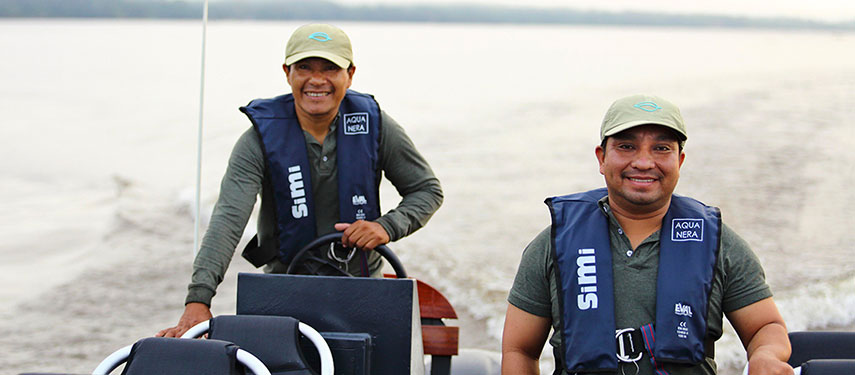 Naturalist guides aboard a boat on the Amazon River