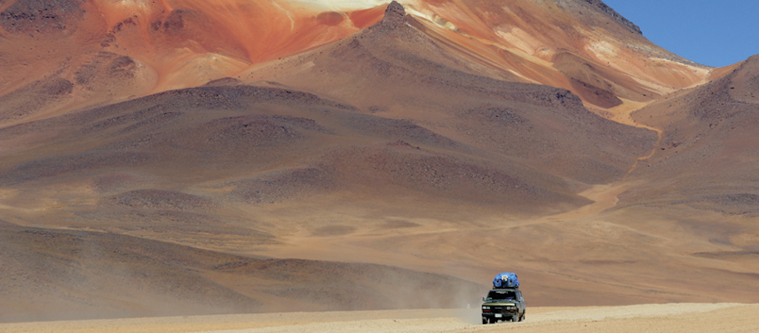 Panoramic view of the Atacama Desert with a four-wheel drive