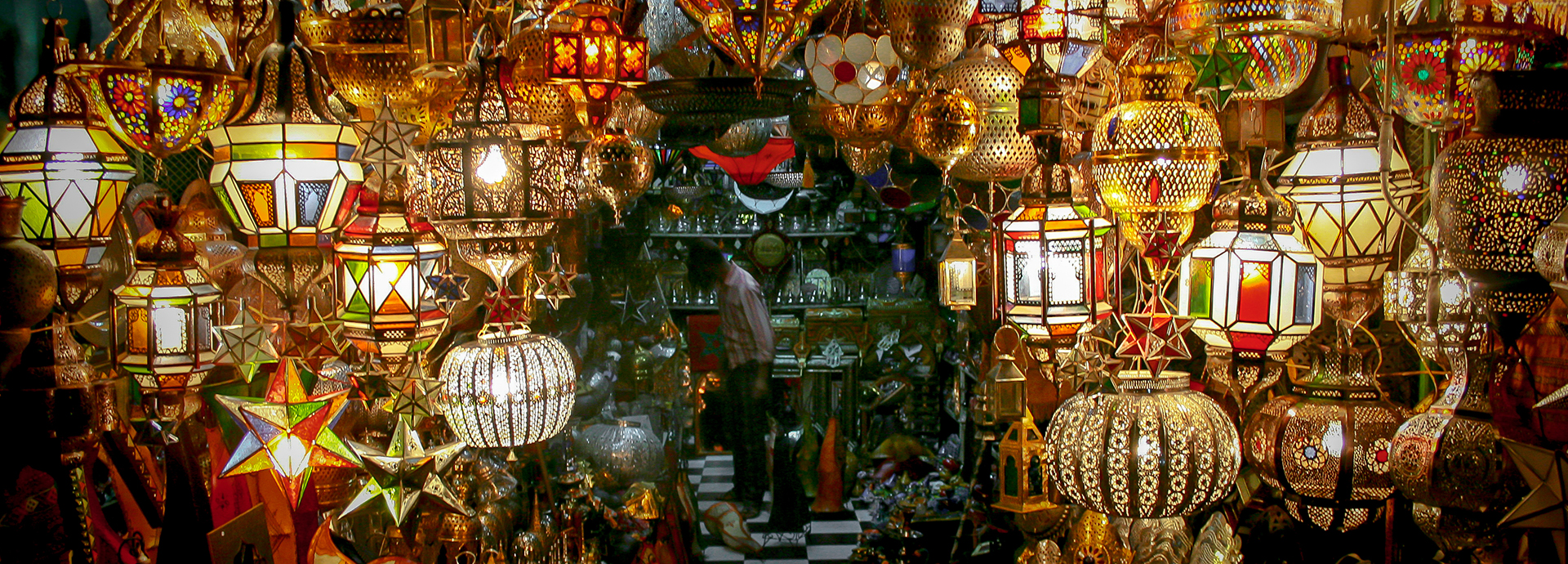 Beautiful glazed lamps hanging in a souk in Marrakech