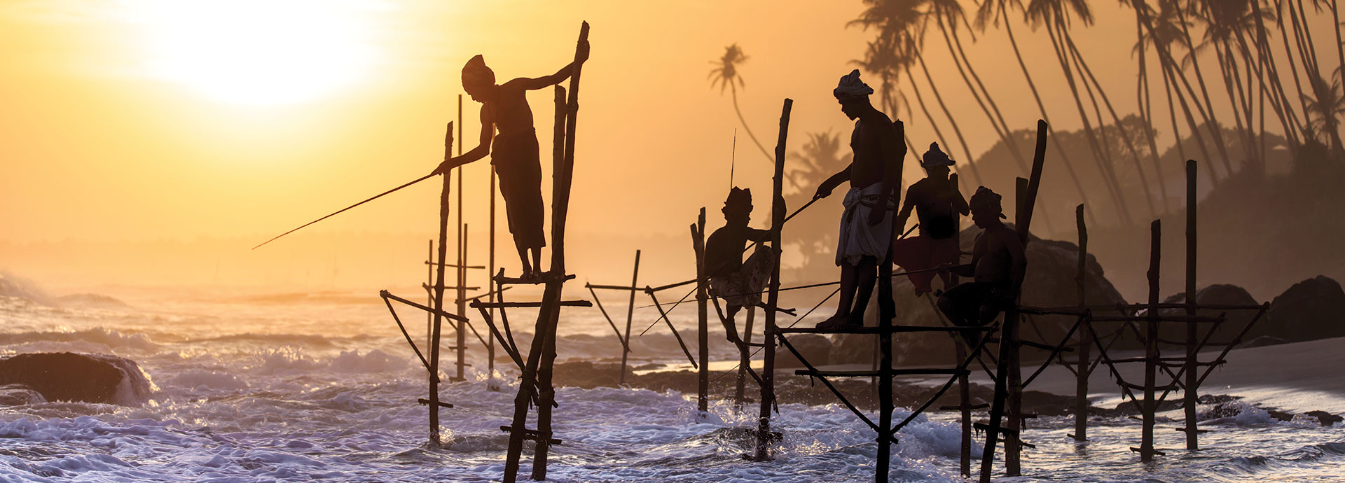 Stilt fishermen on the shores of Sri Lanka