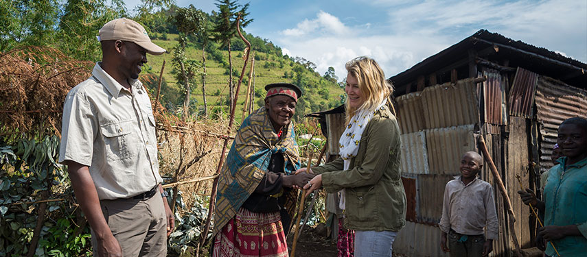 Tourists meeting locals on a cultural visit in Rwanda