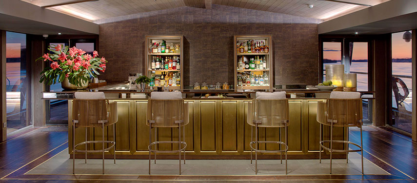 Lounge bar aboard the Aqua Nera luxury Amazon River cruise at sunset