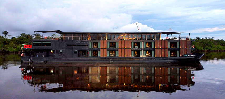 The Aqua Nera luxury boat on a Peruvian Amazon River cruise through the lush Amazon Rainforest
