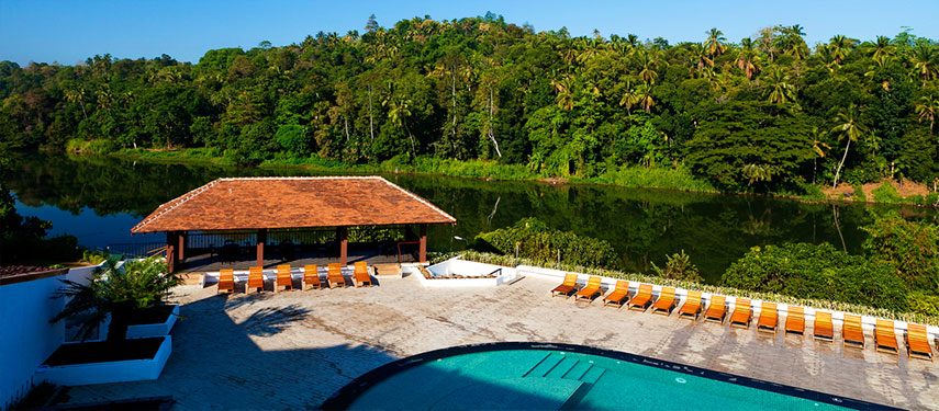 Unwind by the pool overlooking the mighty Mahaweli River when at Cinnamon Citadel