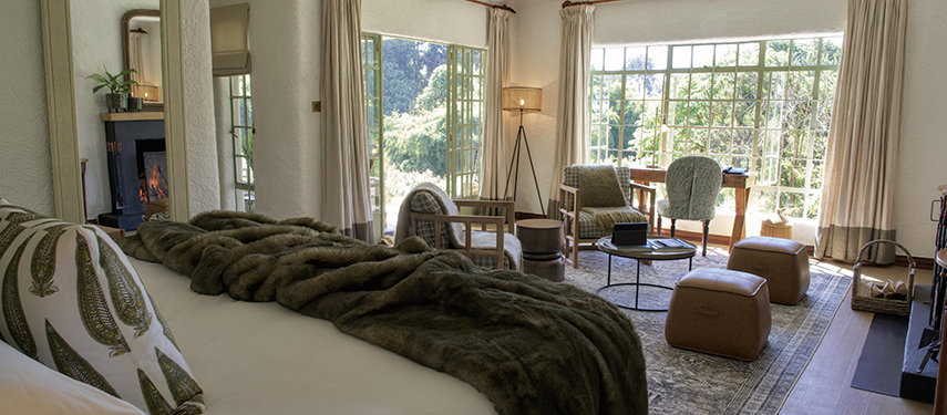 Elegant guest rooms overlook the surrounding mountains of the Volcanoes National Park