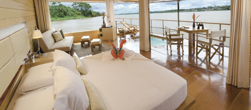 a suite on the Delfin Amazon cruise - views over the river