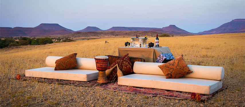 Sundowners in the vast Damaraland at Desert Rhino Camp