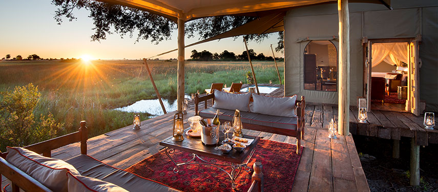 Sundowners looking over the floodplains at Duba Plains