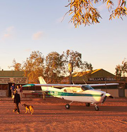A light aircraft on the red sand of The Australian outback