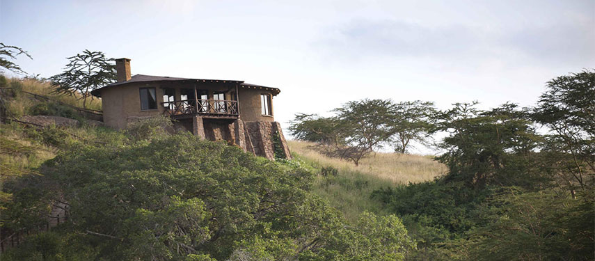 A chalet at The Emakoko standing on a hillside in the bushland surrounding Nairobi National Park, Kenya