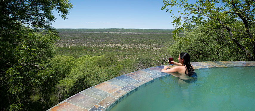 Watch for game from the pool over the Ongava Private Game Reserve at Little Ongava