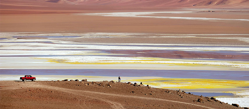 Panoramic view of the Atacama Desert with a four-wheel drive