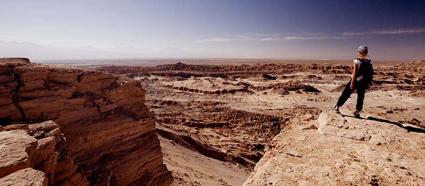 Woman gazing across a canyon in the Atacama Desert of Chile