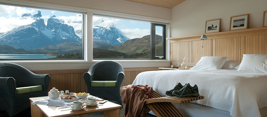 Luxury hotel interior with the spectacular Torres del Paine vista outside.