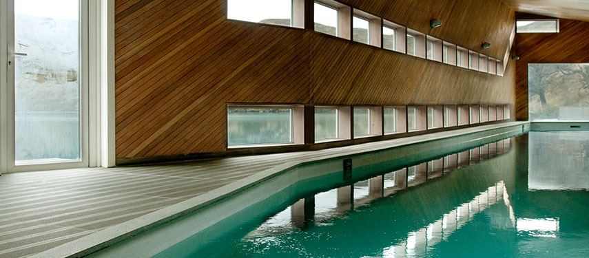 Swimming pool at Explora Patagonia with stunning views through the surrounding windows