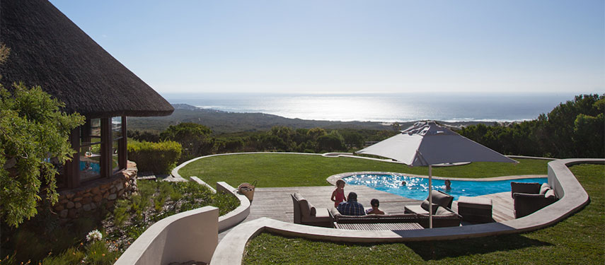 Enjoy family time by the pool with panoramic ocean views at Grootbos Garden Lodge