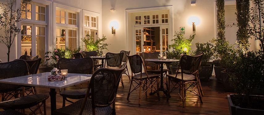Intimate and darkened dining room at Hotel B, Lima