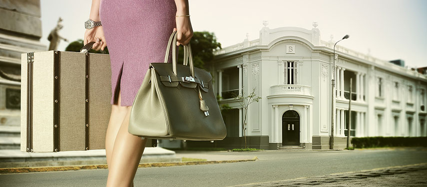 Woman walking towards the architecturally iconic Hotel B, in Lima Peru