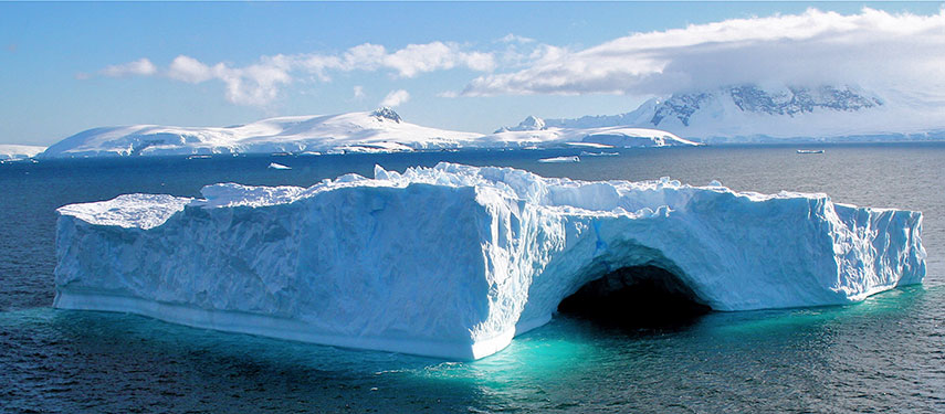 Large iceberg with a cave in it in Antarctica