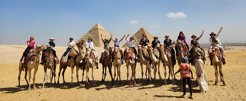 Journeys for Women tour on a camel ride near the Great Pyramids of Egypt