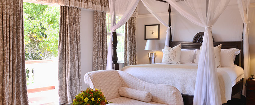 A luxurious bedroom at the Victoria Falls Hotel, Zimbabwe