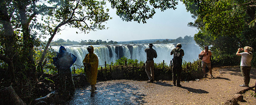 Tourists view Mosi oa-Tunya in full flood