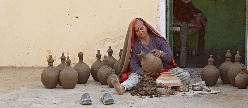 A lady handcrafting pots in Jaipur, India