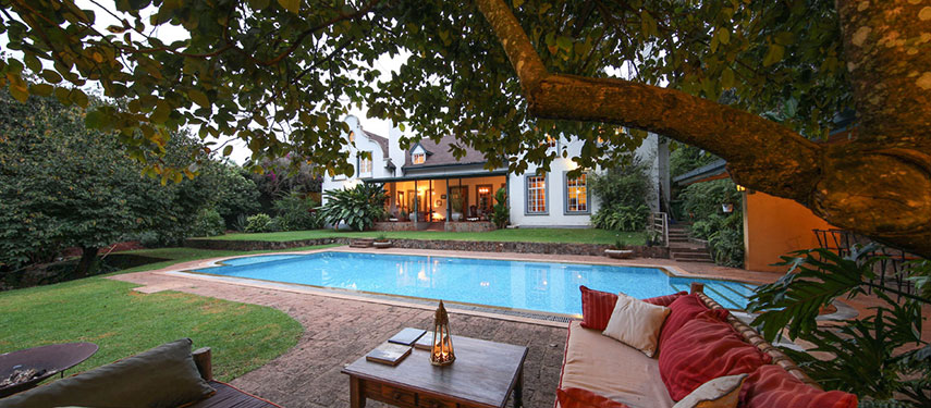 Relax by the garden pool after a long flight at Karen Gables in Nairobi