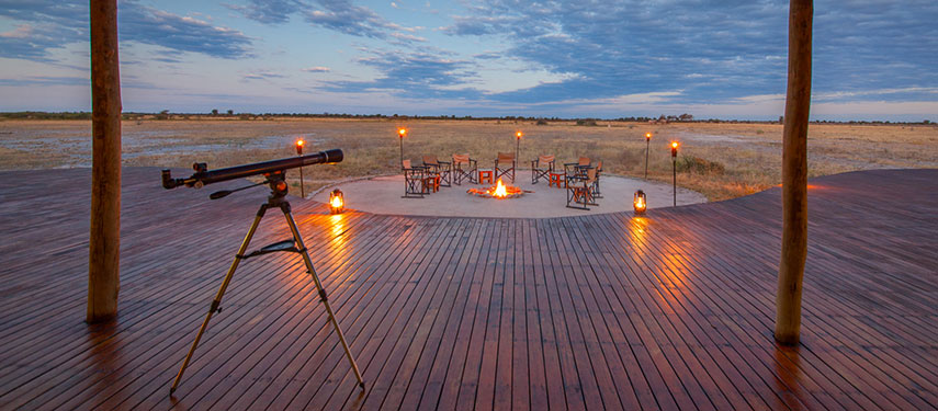 Gather around the campfire or search for lost galaxies using the telescope at Kwando Nxai Pan Camp