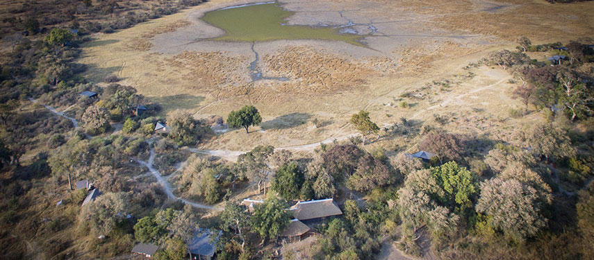 Aerial views of camp and of the large water pan located at the front of Splash Camp in Botswana