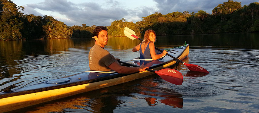 Two people kayaking on the Napo River, Ecuador