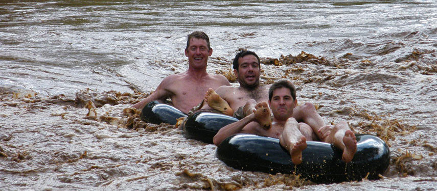 Tourists floating on the Mara River in inflatable tubes