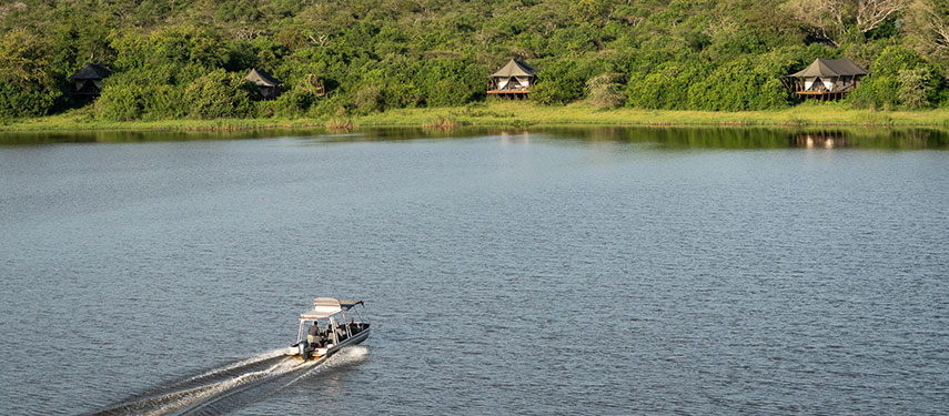 Tourists boating towards Magashi Camp on Lake Rwanyakazinga, Akagera National Park, Rwanda