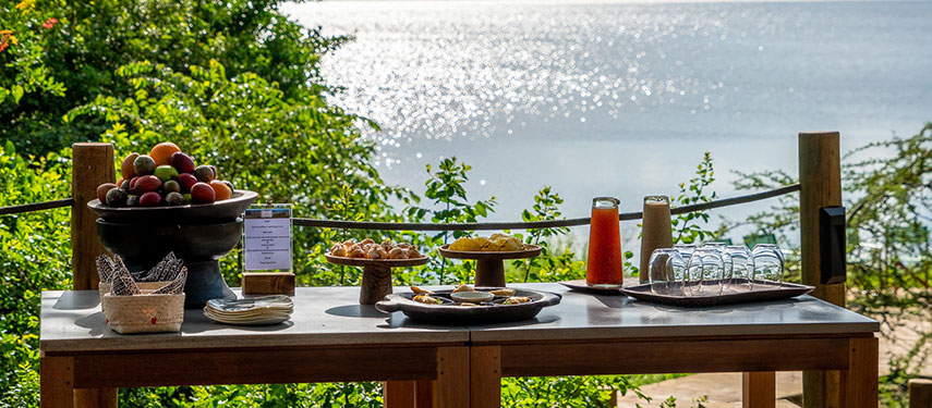 Breakfast is served at Magashi Camp with views across Lake Rwanyakazinga, Rwanda