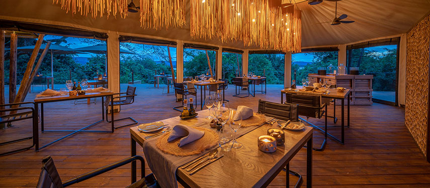 The dining area at Magashi Camp at sunset