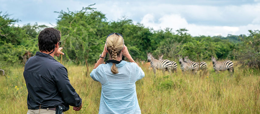 Couple on a walking safari in Akagera National Park