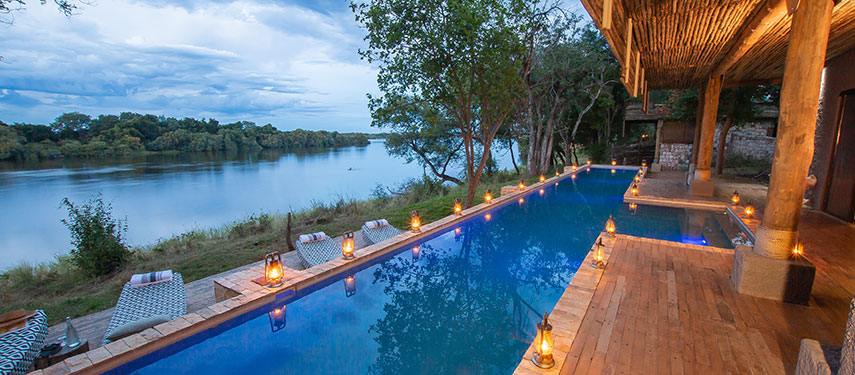 Watch out over the Zambezi River from the comfort of the pool at Matetsi River Lodge