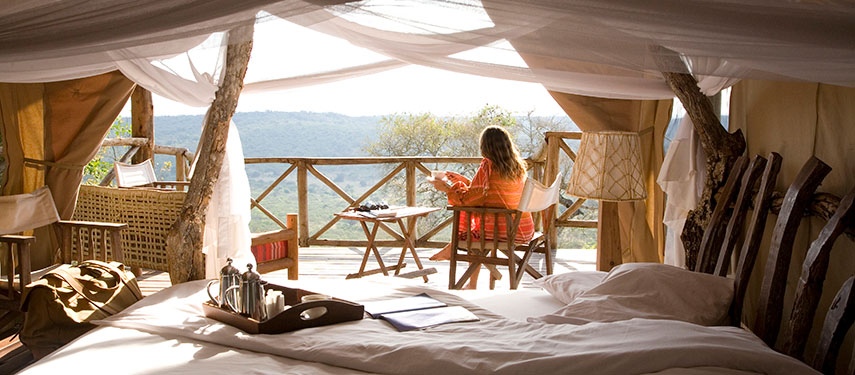 Watching wildlife at the waterhole at Mihingo Lodge