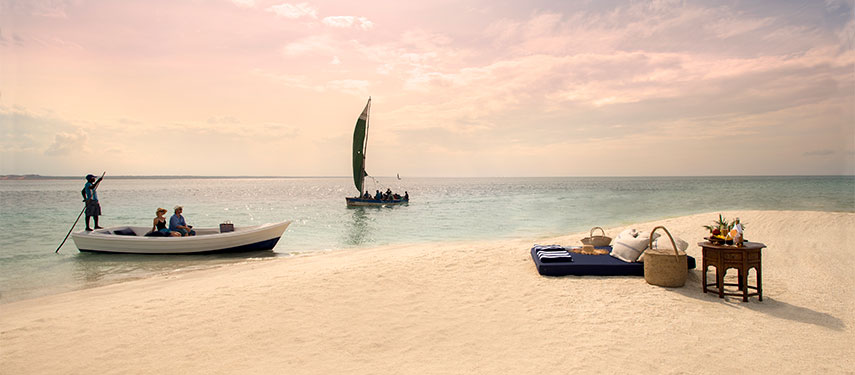 Romantic sunset dinner and drinks on a sandbank at andBeyond Benguerra Island
