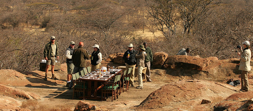 Enjoy a communal camp lunch amidst the plains at Mwiba Tented Camp