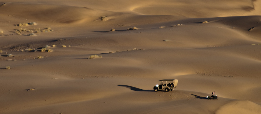 Game drive and sundowners in the dunes of Kaokoveld, Namibia