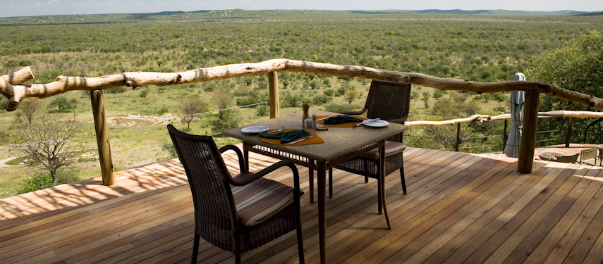 Rest for a drink in the main lounge at Ongava looking out into the Ongava Game Reserve
