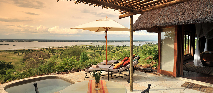 Private suite patio at Ngoma Safari Lodge with plunge pool and loungers overlooking the Chobe River valley.