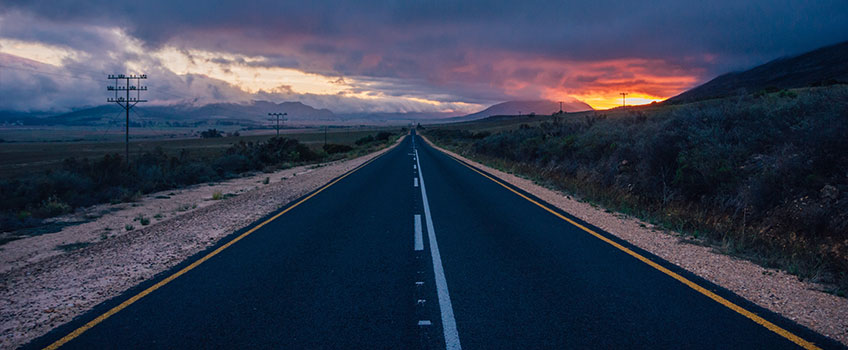A long stretch of highway at sunset in South Africa