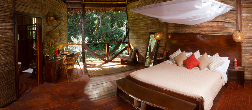 Full of rustic charm each of the bedrooms at Refugio Amazonas Lodge has an open wall facing the Amazon rainforest.