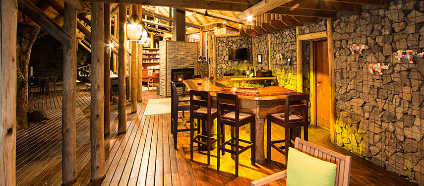 The cosy dining deck at sundown at Rhino Post Safari Lodge in Kruger National Park, South Africa