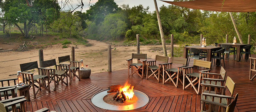 Boma and fire pit at sundown at Rhino Post Safari Lodge in Kruger National Park, South Africa