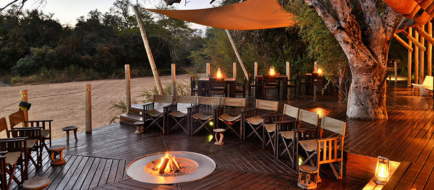 Boma and fire pit at sundown at Rhino Post Safari Lodge in Kruger National Park, South Africa